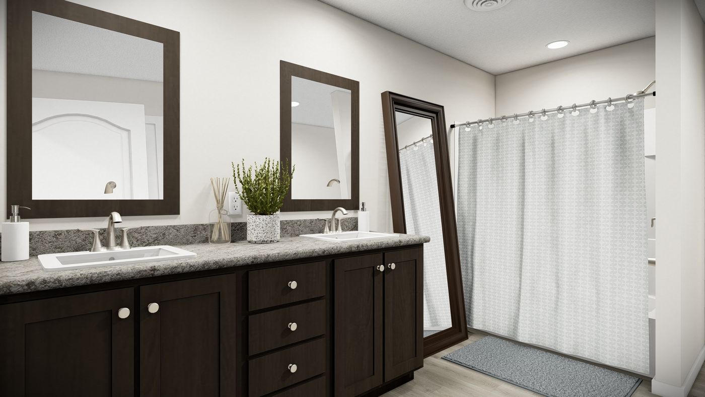 The TULIP BLVD/6028-MS047-1 SECT Primary Bathroom. This Manufactured Mobile Home features 3 bedrooms and 2 baths.