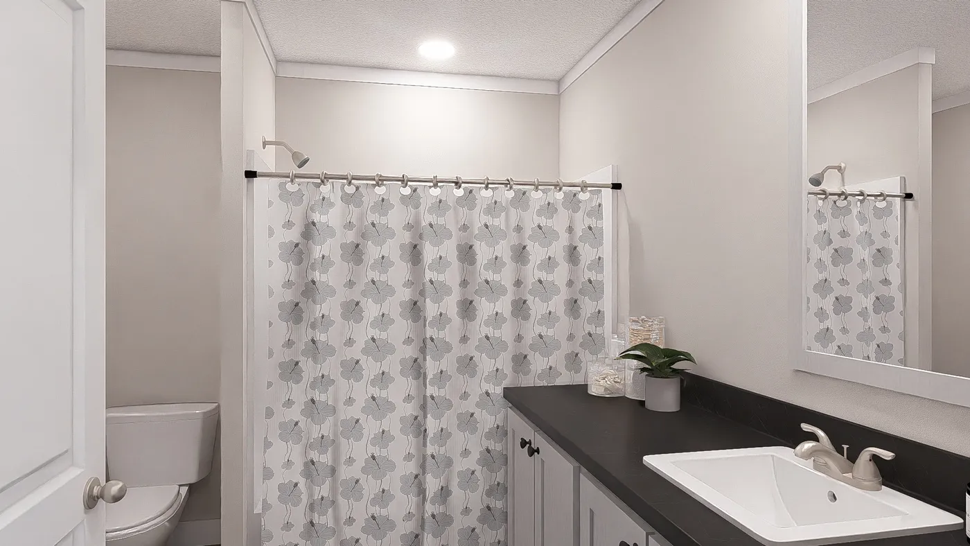 The LET IT BE Guest Bathroom. This Manufactured Mobile Home features 3 bedrooms and 2 baths.