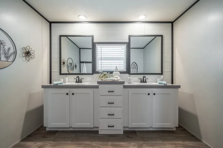 The BREEZE FARMHOUSE Primary Bathroom. This Manufactured Mobile Home features 3 bedrooms and 2 baths.