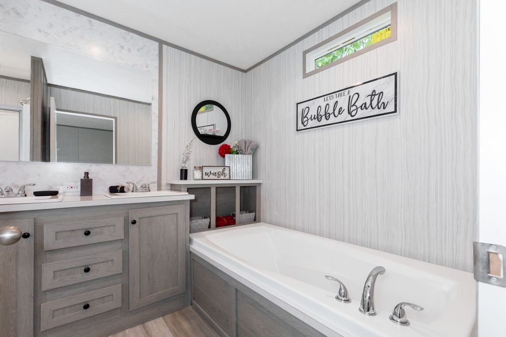 The THE ANNIVERSARY 76 Primary Bathroom. This Manufactured Mobile Home features 3 bedrooms and 2 baths.