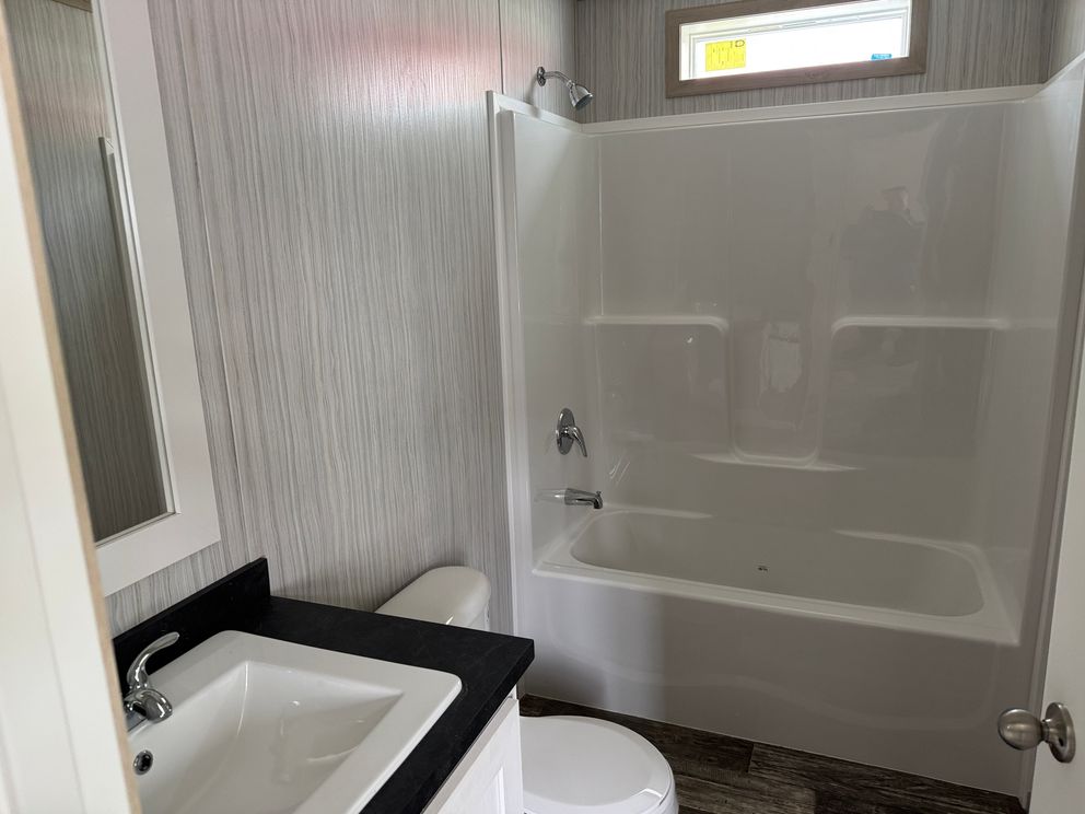 The ONYX Primary Bathroom. This Manufactured Mobile Home features 1 bedroom and 1 bath.