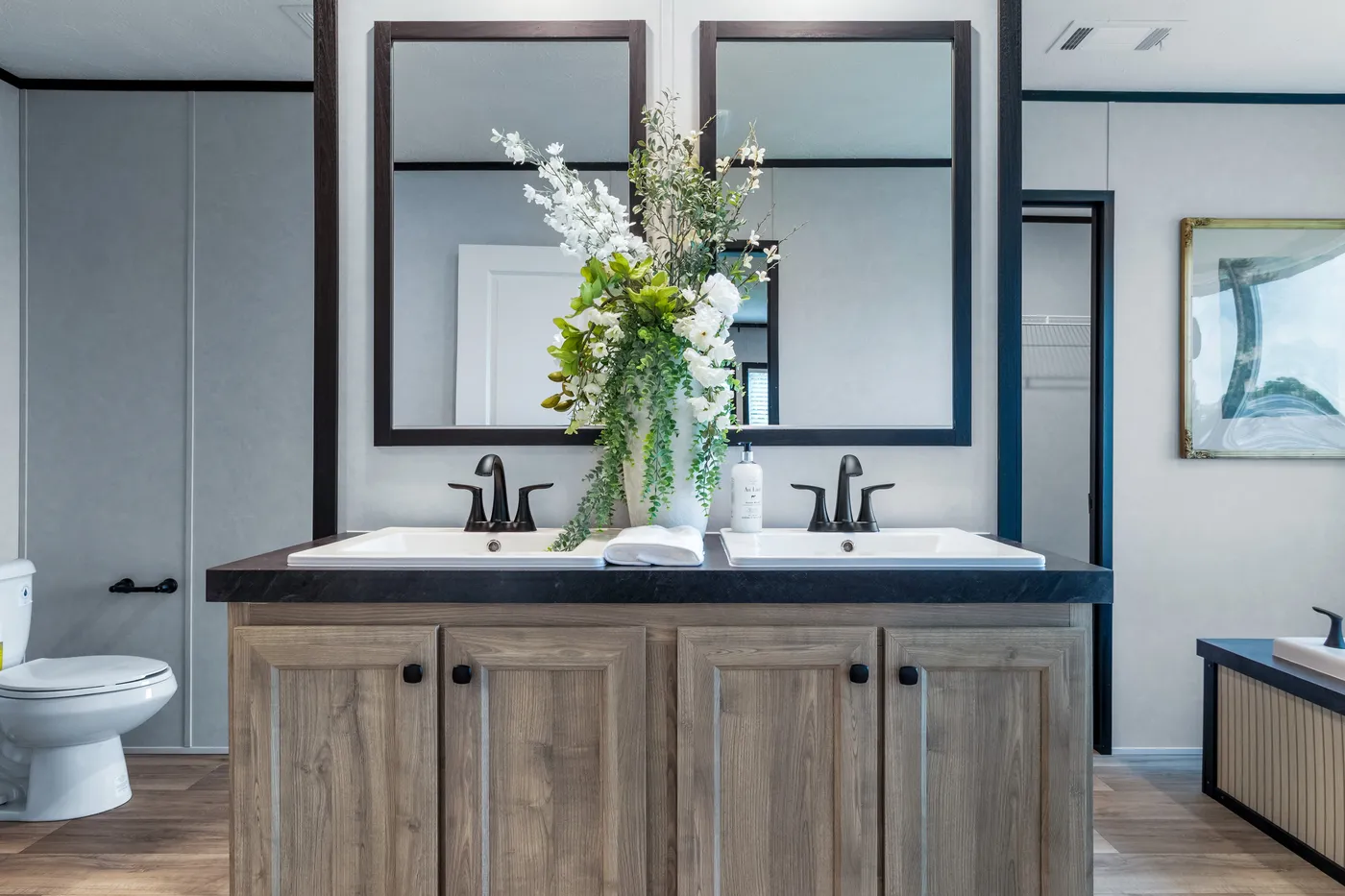 The ODYSSEY Primary Bathroom. This Manufactured Mobile Home features 4 bedrooms and 2 baths.