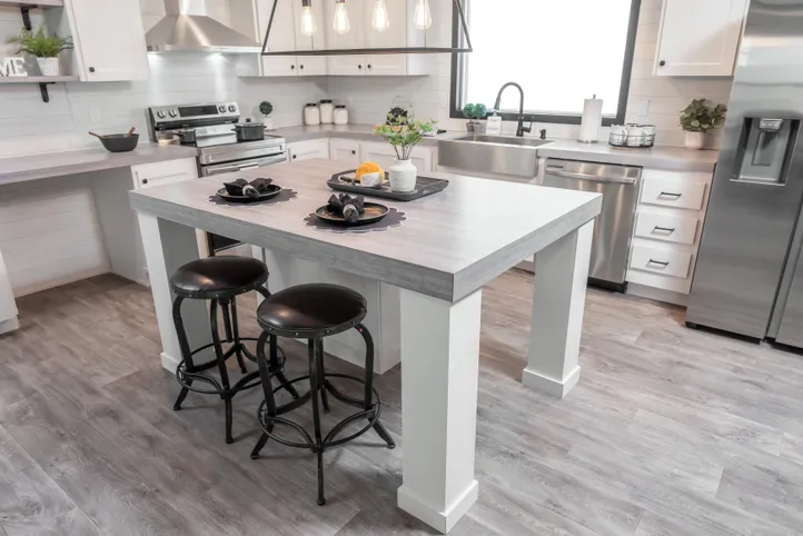 The BREEZE FARMHOUSE Kitchen. This Manufactured Mobile Home features 3 bedrooms and 2 baths.