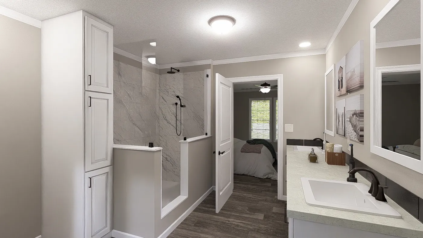 The THE LIL' EASY Primary Bathroom. This Manufactured Mobile Home features 3 bedrooms and 2 baths.