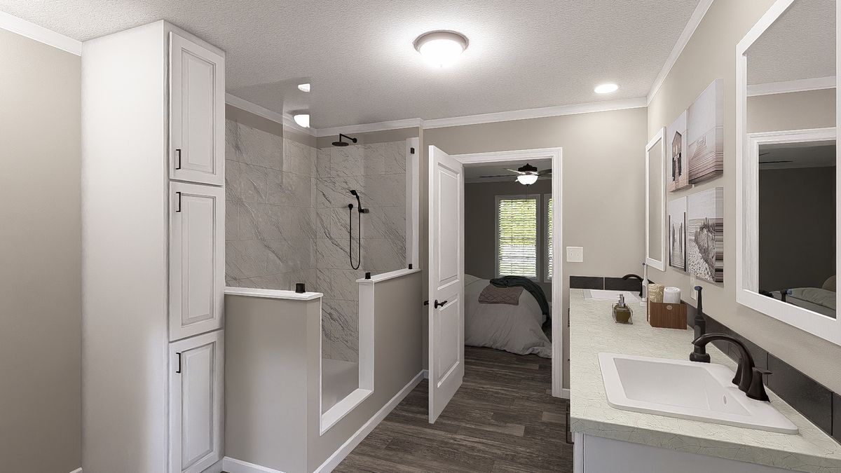 The THE LIL' EASY Primary Bathroom. This Manufactured Mobile Home features 3 bedrooms and 2 baths.