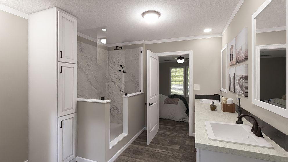 The THE LIL' EASY Primary Bathroom. This Manufactured Mobile Home features 3 bedrooms and 2 baths.
