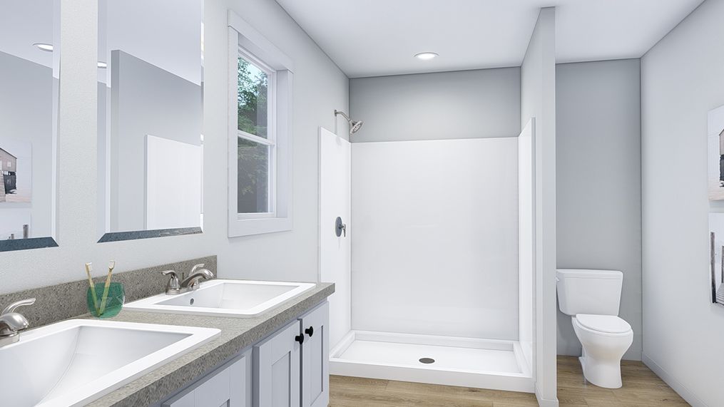 The LOVELY DAY Master Bathroom. This Manufactured Mobile Home features 4 bedrooms and 2 baths.