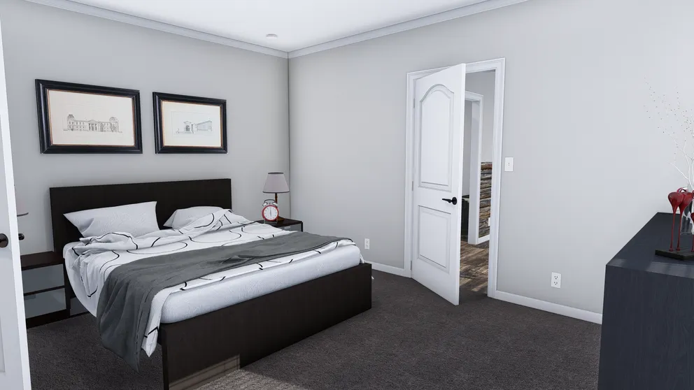 The THE HOLLYWOOD Primary Bedroom. This Manufactured Mobile Home features 3 bedrooms and 2 baths.