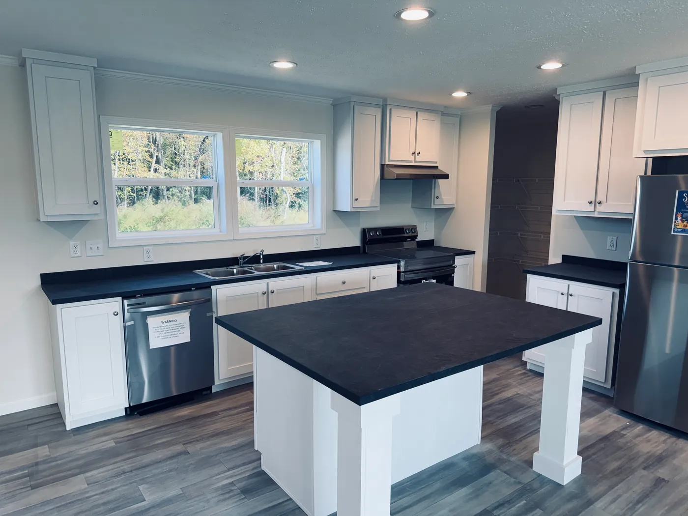 The TOURMALINE 7628-649 Kitchen. This Manufactured Mobile Home features 4 bedrooms and 2 baths.