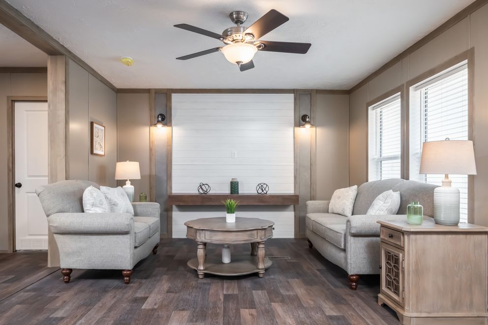 The FARMHOUSE BREEZE 72 Living Room. This Manufactured Mobile Home features 4 bedrooms and 2 baths.
