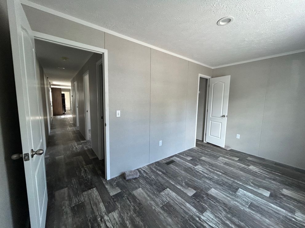 The SAPPHIRE XL 8016-644 Guest Bedroom. This Manufactured Mobile Home features 3 bedrooms and 2 baths.
