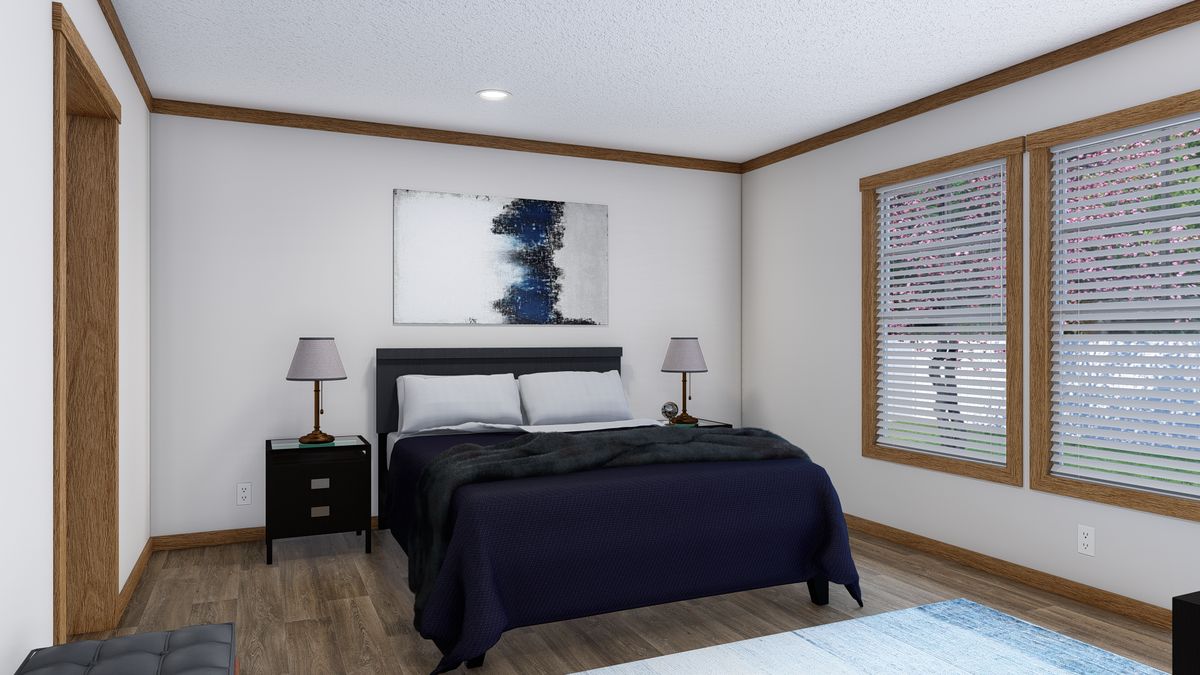 The LAYLA Primary Bedroom. This Manufactured Mobile Home features 4 bedrooms and 2 baths.