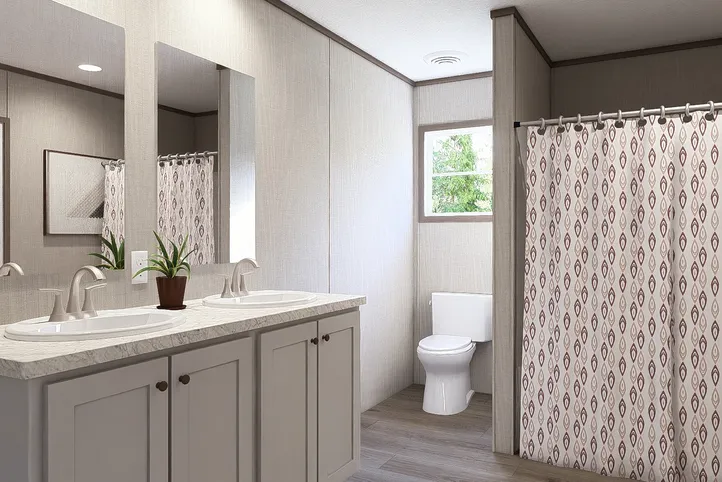 The LEGEND BIG BOY Primary Bathroom. This Manufactured Mobile Home features 4 bedrooms and 2 baths.