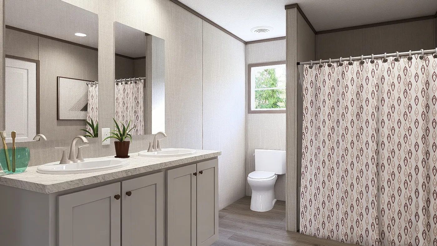 The LEGEND BIG BOY Primary Bathroom. This Manufactured Mobile Home features 4 bedrooms and 2 baths.