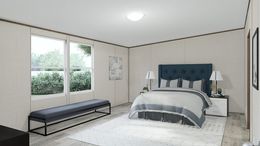 The TRIUMPH Primary Bedroom. This Manufactured Mobile Home features 5 bedrooms and 3 baths.