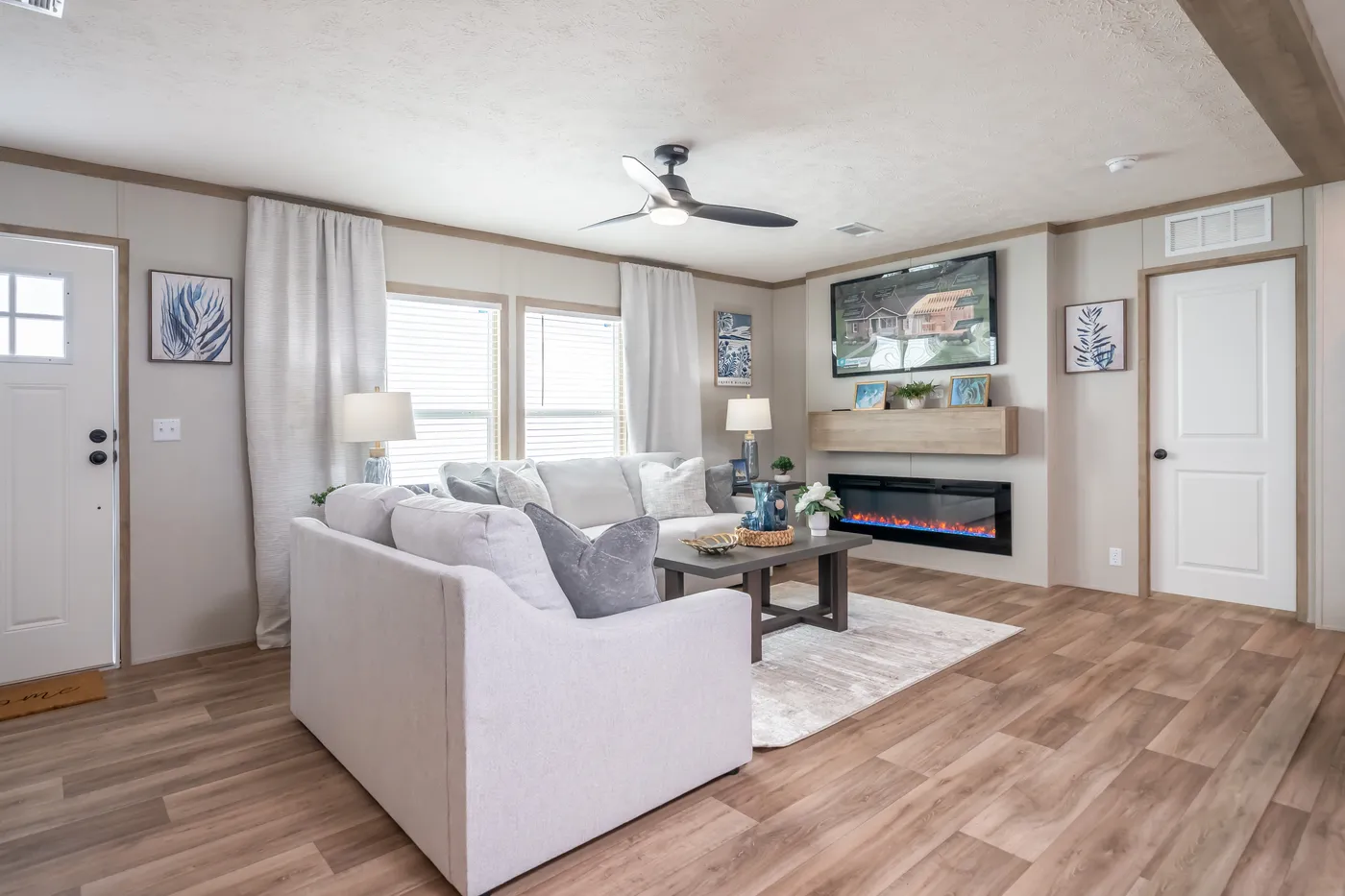 The EL SUENO BREEZE Living Room. This Manufactured Mobile Home features 4 bedrooms and 2 baths.