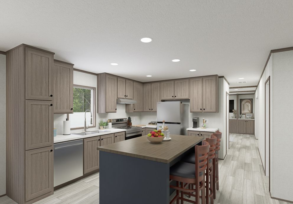 The THE MOUNTAINEER 64 Kitchen. This Manufactured Mobile Home features 3 bedrooms and 2 baths.