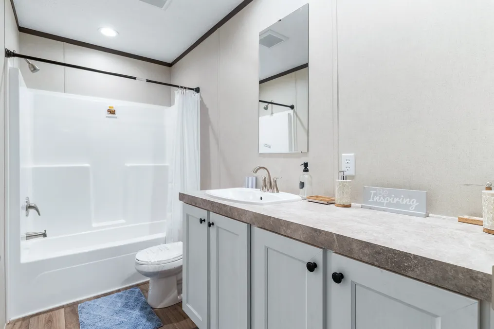 The THE DISCOVER Primary Bathroom. This Manufactured Mobile Home features 3 bedrooms and 2 baths.