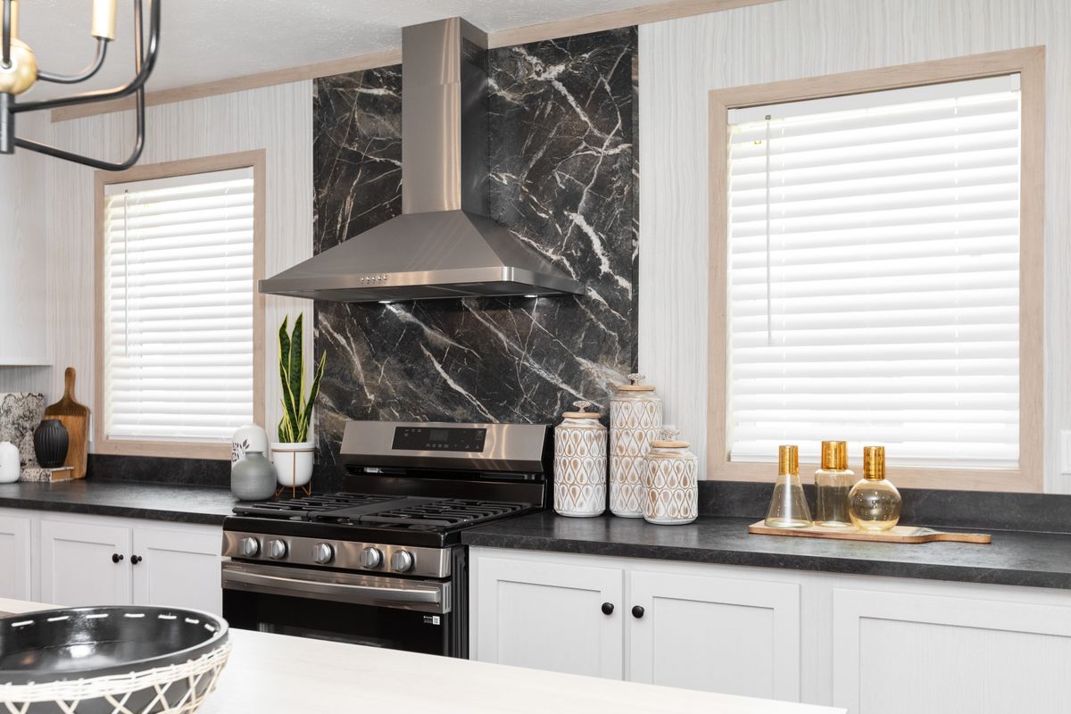 The 6032-5700 THE PULSE Kitchen. This Manufactured Mobile Home features 3 bedrooms and 2 baths.