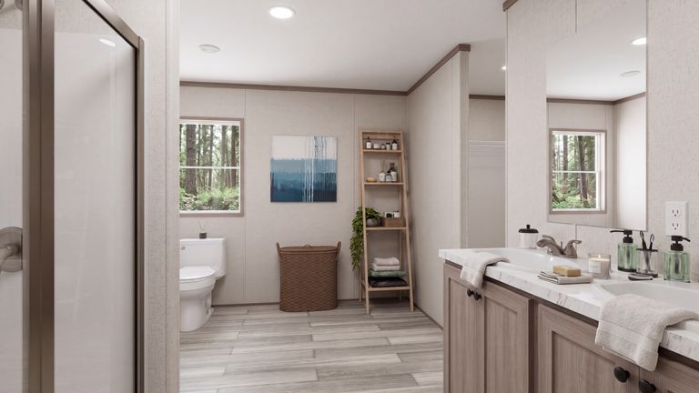 The THE MOUNTAINEER 60 Primary Bathroom. This Manufactured Mobile Home features 3 bedrooms and 2 baths.
