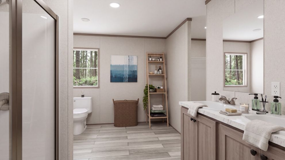 The THE MOUNTAINEER 60 Primary Bathroom. This Manufactured Mobile Home features 3 bedrooms and 2 baths.