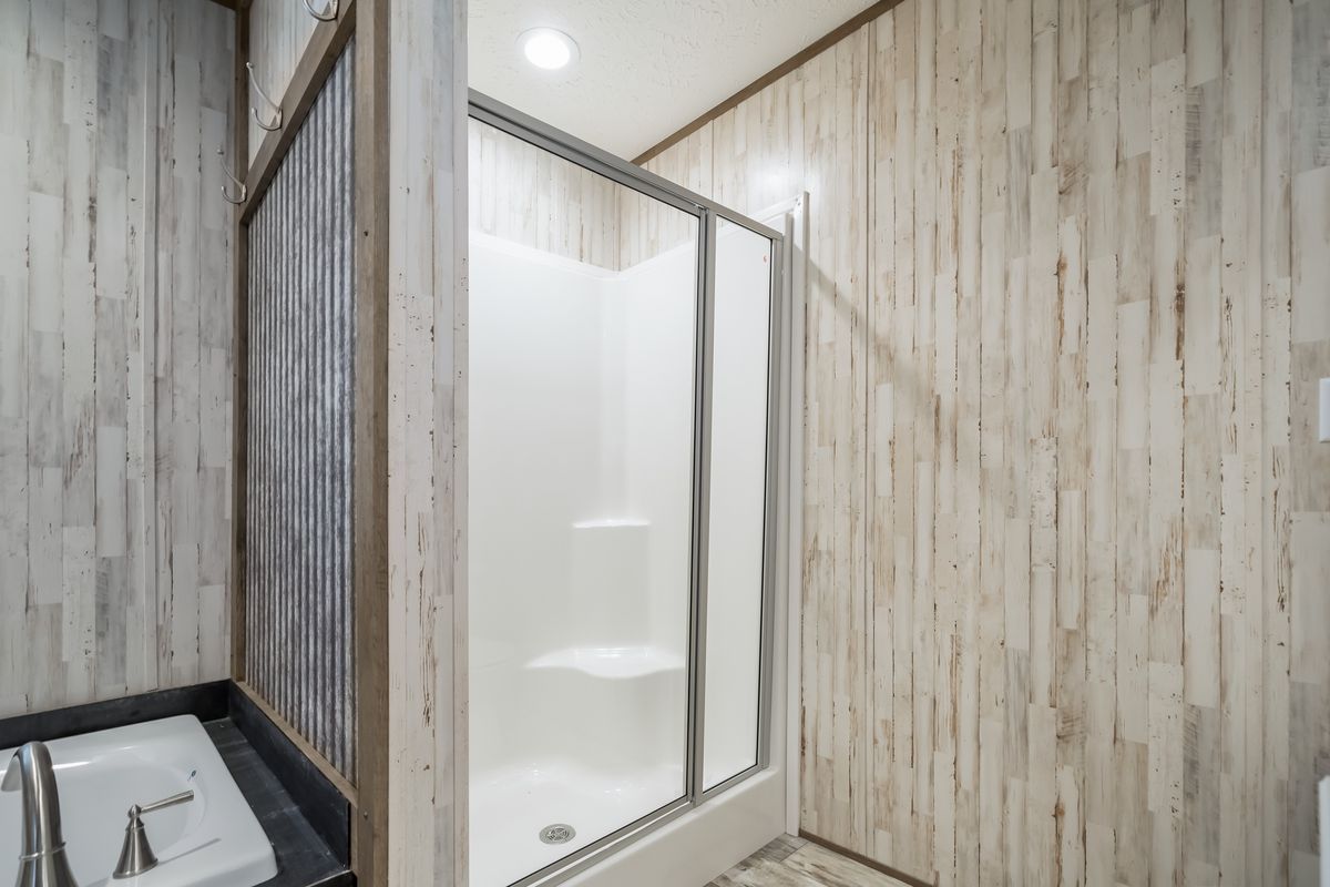 The ANNIVERSARY SPLASH Primary Bathroom. This Manufactured Mobile Home features 3 bedrooms and 2 baths.