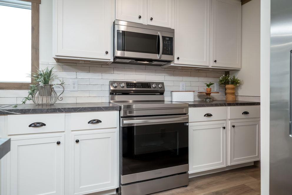 The THE LIZZIE Kitchen. This Manufactured Mobile Home features 3 bedrooms and 2 baths.