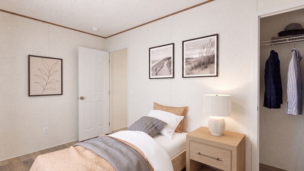 The HICKORY Guest Bedroom. This Manufactured Mobile Home features 3 bedrooms and 2 baths.