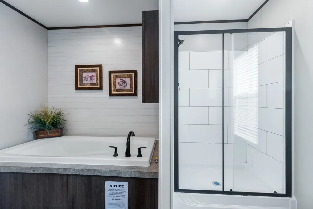 The HERCULES Primary Bathroom. This Manufactured Mobile Home features 4 bedrooms and 2 baths.