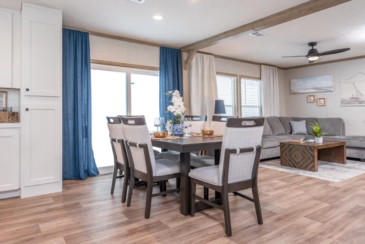 The EL SUENO BREEZE Dining Area. This Manufactured Mobile Home features 4 bedrooms and 2 baths.