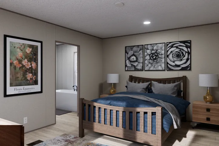 The THE ANNIVERSARY 76 Primary Bedroom. This Manufactured Mobile Home features 3 bedrooms and 2 baths.