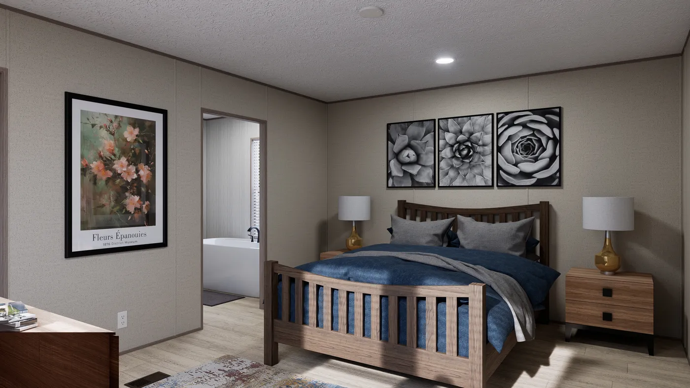 The THE ANNIVERSARY 76 Primary Bedroom. This Manufactured Mobile Home features 3 bedrooms and 2 baths.