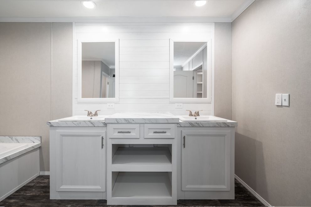 The ALL AMERICAN Primary Bathroom. This Manufactured Mobile Home features 3 bedrooms and 2 baths.