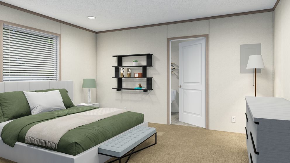 The 7616-4779 THE PULSE Primary Bedroom. This Manufactured Mobile Home features 3 bedrooms and 2 baths.