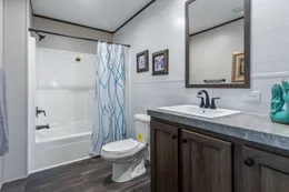 The HERCULES Guest Bathroom. This Manufactured Mobile Home features 4 bedrooms and 2 baths.