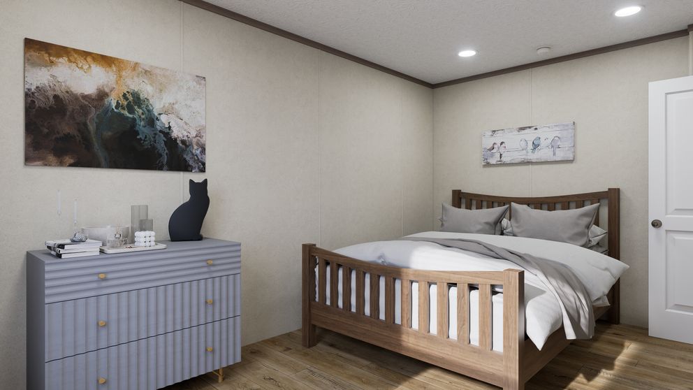 The 5216-CC05 OASIS 52 Primary Bedroom. This Manufactured Mobile Home features 2 bedrooms and 1 bath.