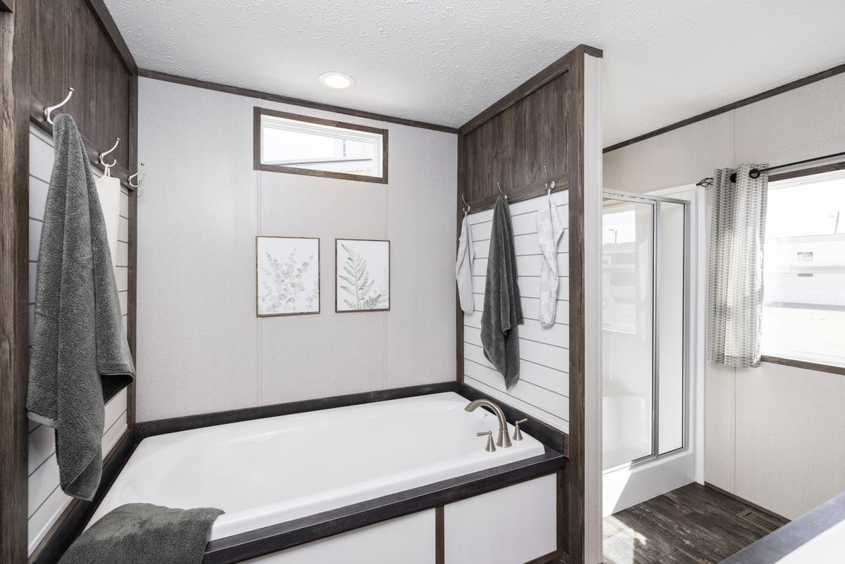 The THE SURE THING Primary Bathroom. This Manufactured Mobile Home features 3 bedrooms and 2 baths.