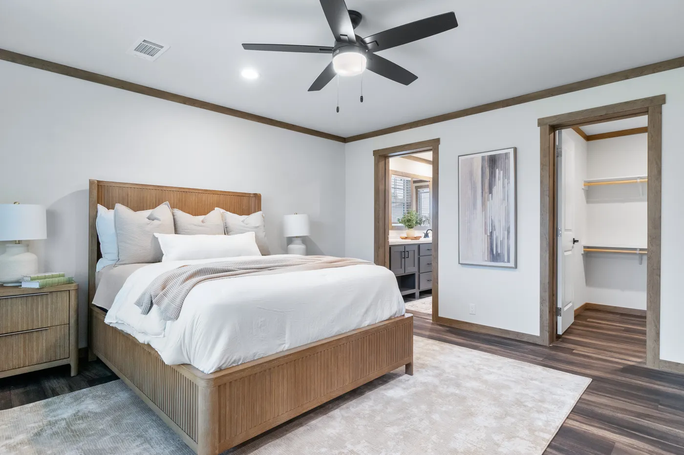 The EVERETT ELITE Primary Bedroom. This Manufactured Mobile Home features 4 bedrooms and 3 baths.