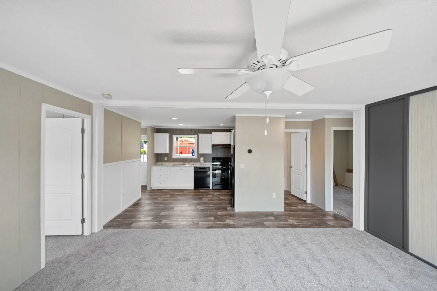 The ZIRCON Living Room. This Manufactured Mobile Home features 3 bedrooms and 2 baths.