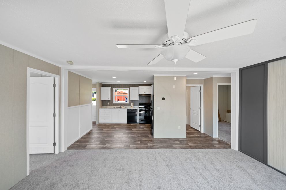 The ZIRCON Living Room. This Manufactured Mobile Home features 3 bedrooms and 2 baths.