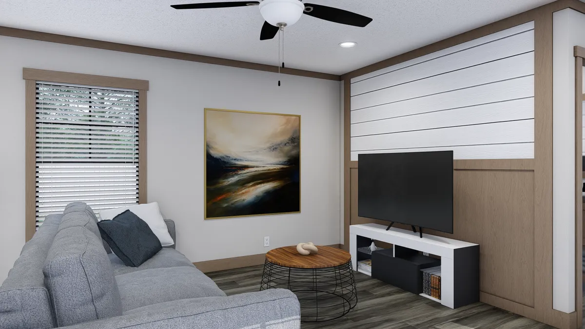 The TRINITY 60 Living Room. This Manufactured Mobile Home features 2 bedrooms and 2 baths.