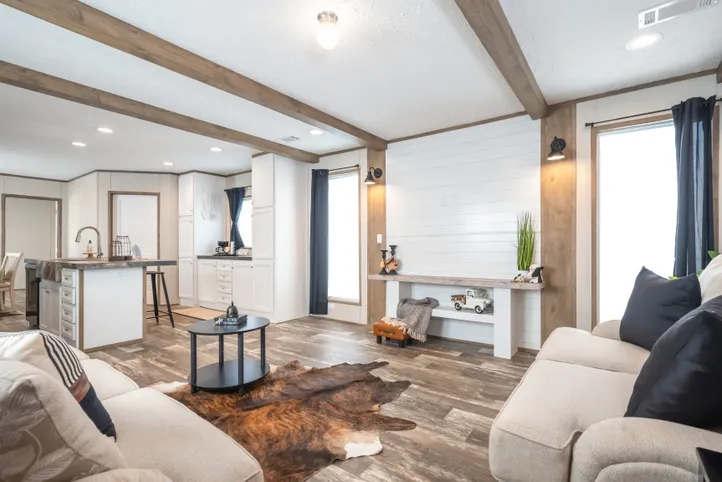 The RIVERHAVEN Living Room. This Manufactured Mobile Home features 3 bedrooms and 2 baths.