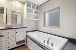 The ANNIVERSARY 16763F Primary Bathroom. This Manufactured Mobile Home features 3 bedrooms and 2 baths.