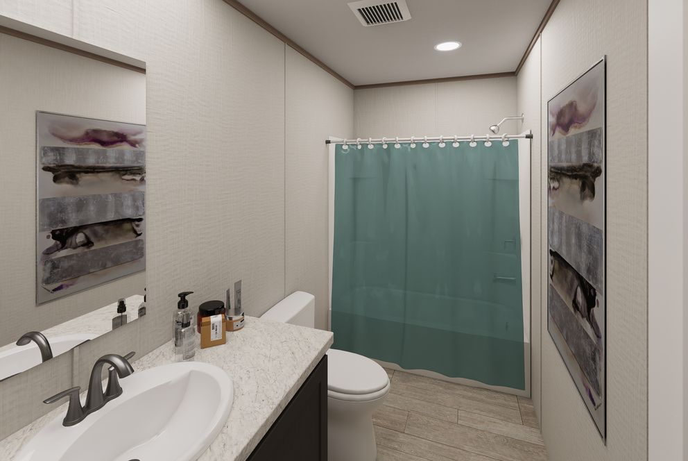 The ULTRA FLEX JEWEL Guest Bathroom. This Manufactured Mobile Home features 3 bedrooms and 2 baths.