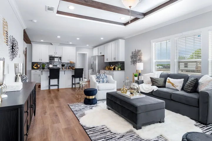 The THE CHANEL Living Room. This Manufactured Mobile Home features 4 bedrooms and 3 baths.