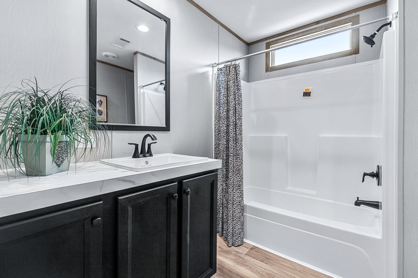 The ANATOLIA Guest Bathroom. This Manufactured Mobile Home features 3 bedrooms and 2 baths.