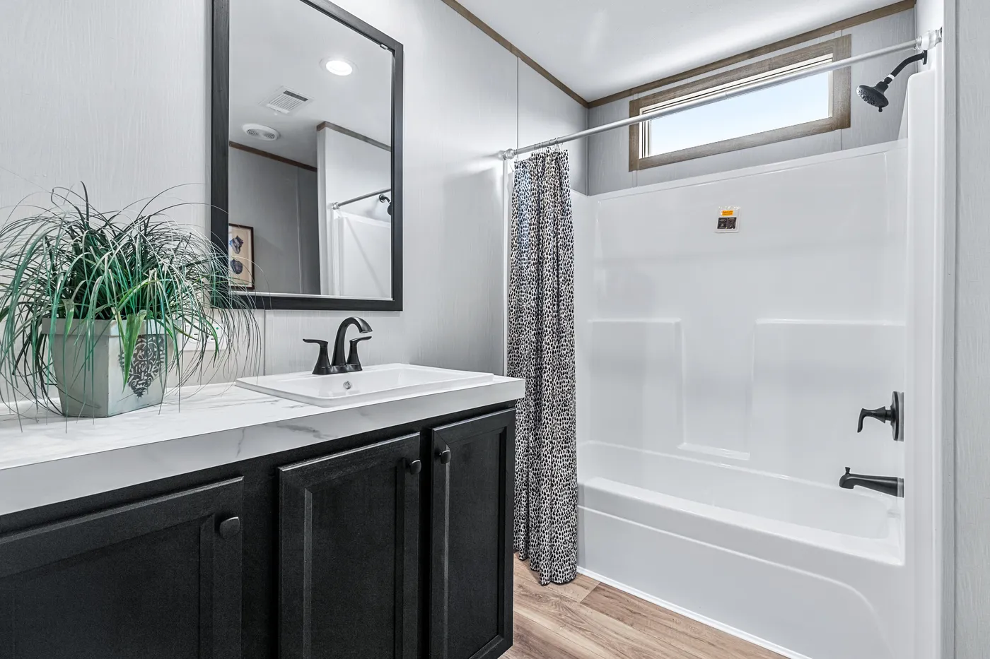 The ANATOLIA Guest Bathroom. This Manufactured Mobile Home features 3 bedrooms and 2 baths.