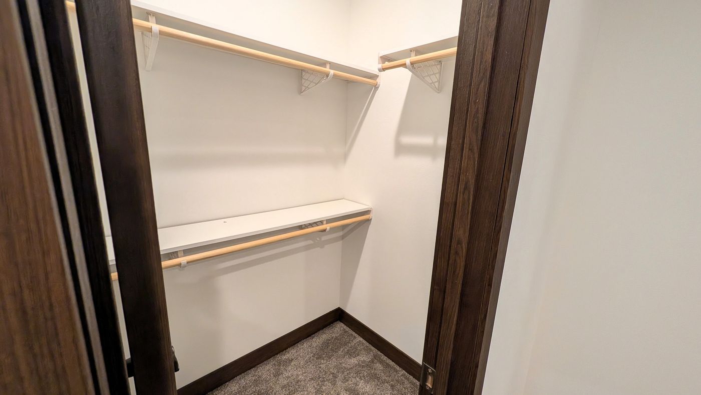 The LEGEND 402 MOD Bedroom. This Modular Home features 3 bedrooms and 2 baths.