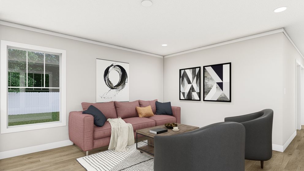The SWEET CAROLINE Living Room. This Manufactured Mobile Home features 3 bedrooms and 2 baths.