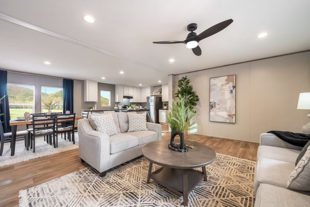 The ECLIPSE Living Room. This Manufactured Mobile Home features 4 bedrooms and 2 baths.
